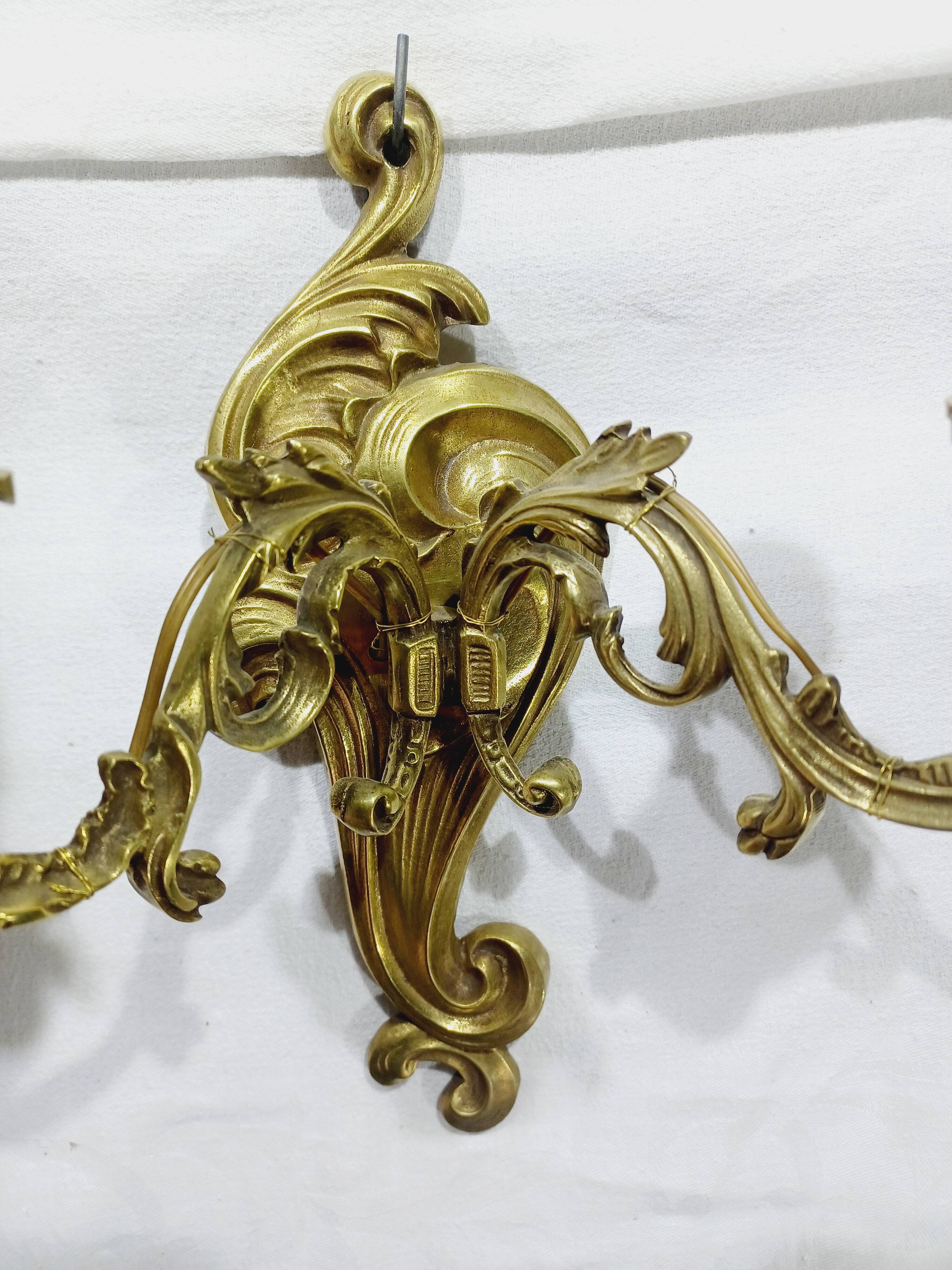 Pair of 2-light bronze wall lights, St. Louis XV