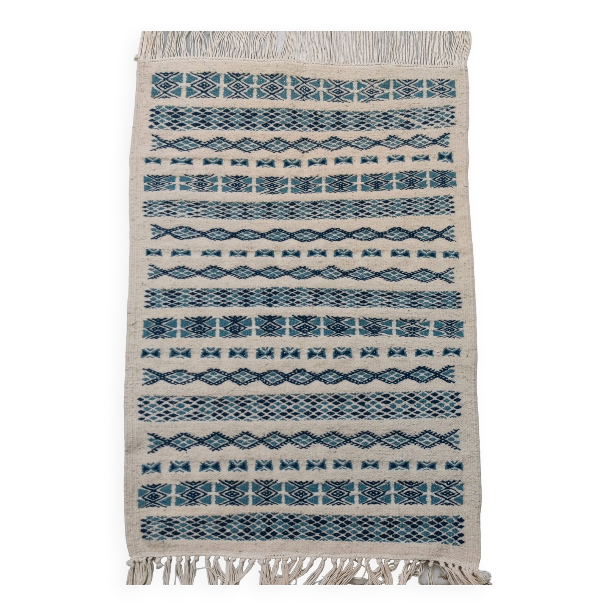 Traditional handmade white and blue carpet