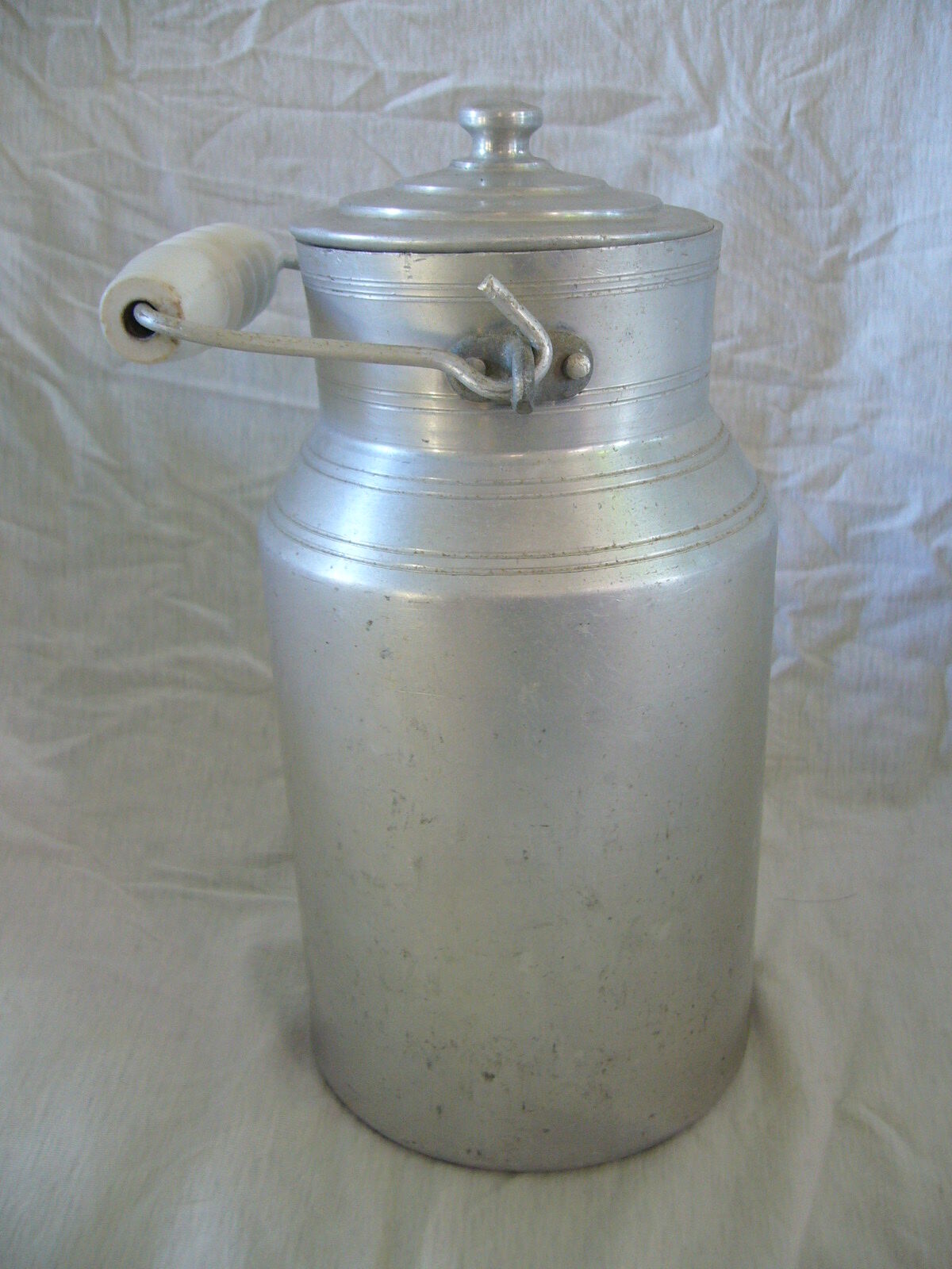 Old aluminum milk pot