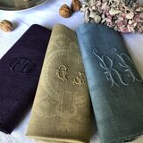 Suite of four tinted antique napkins