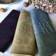 Suite of four tinted antique napkins