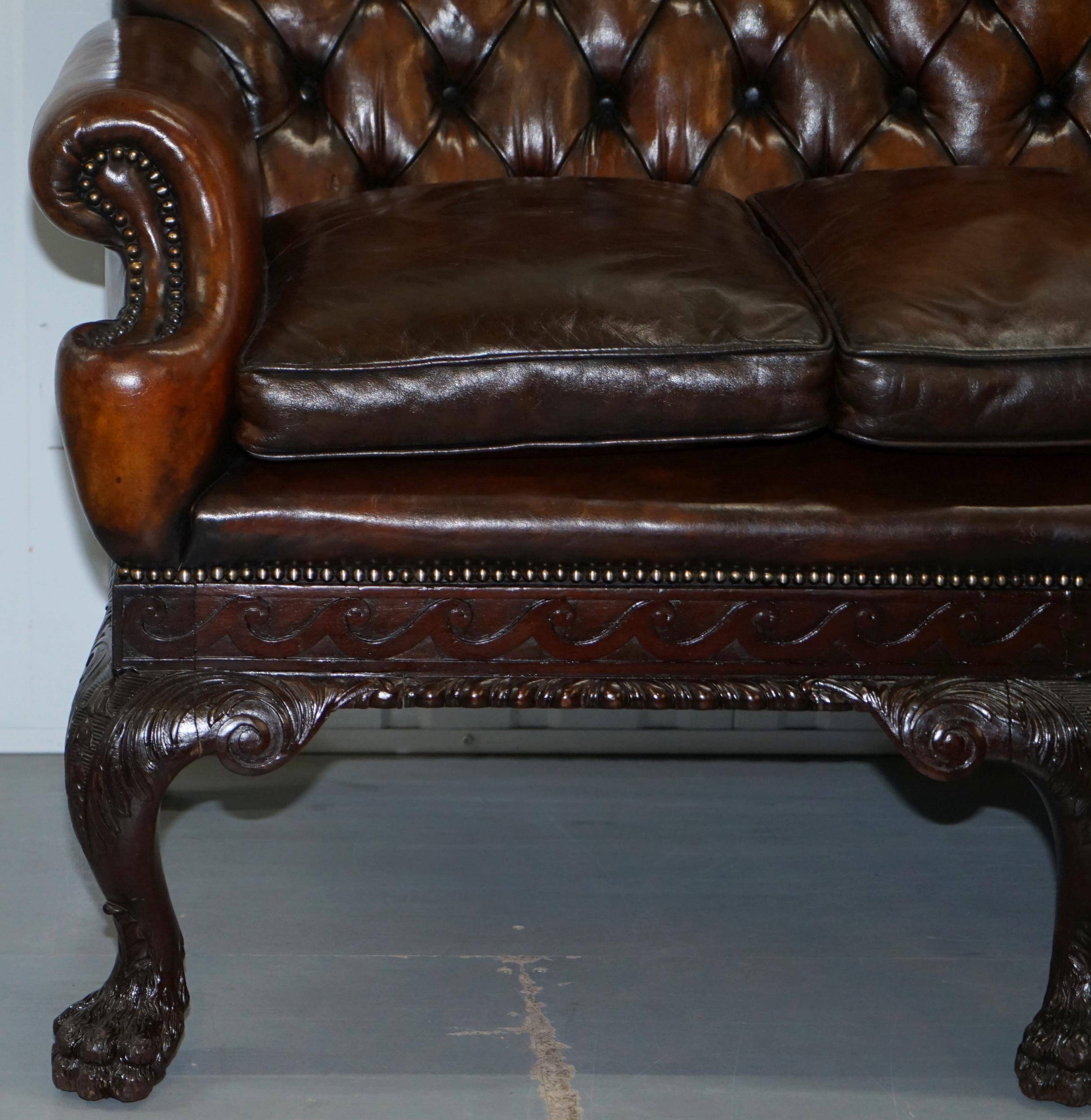 Chesterfield leather canapé in Georgian style with lion paw carved feet.