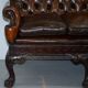 Chesterfield leather canapé in Georgian style with lion paw carved feet.