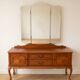 Antique wooden dressing table with a triptych mirror.
