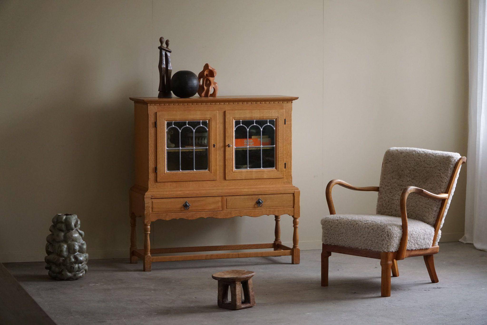 20th-century solid oak display cabinet with a glass front, by a Danish cabinetmaker.