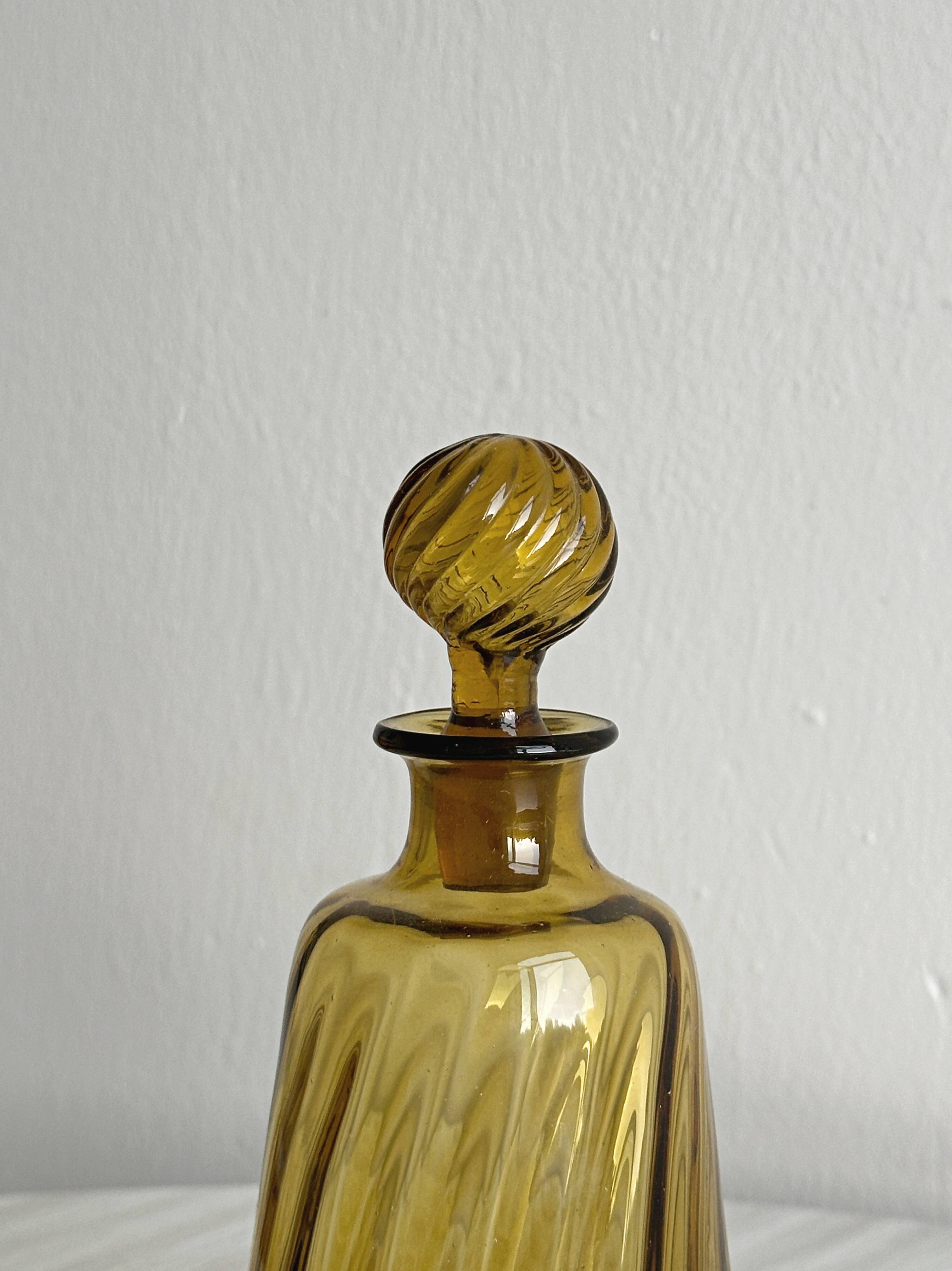 Twisted amber glass carafe