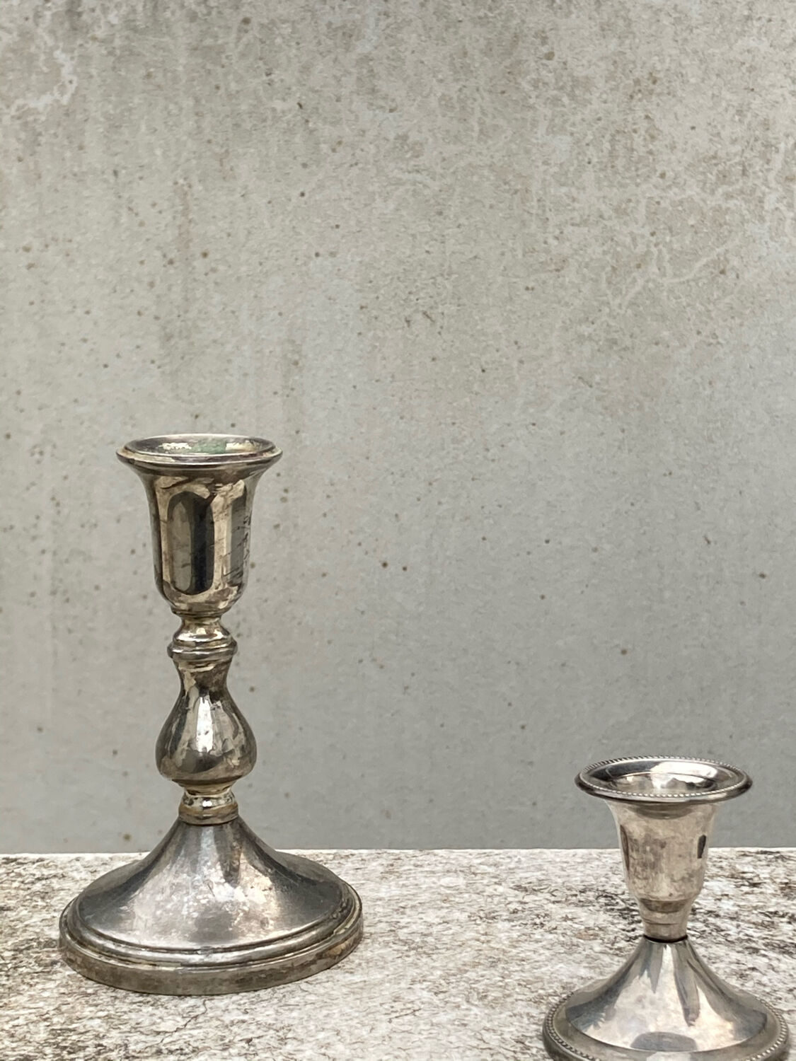 Two antique candle holders