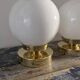 Set of two white opaline ball wall lights