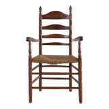 Antique wooden armchair with cane seat, France ca. 1900