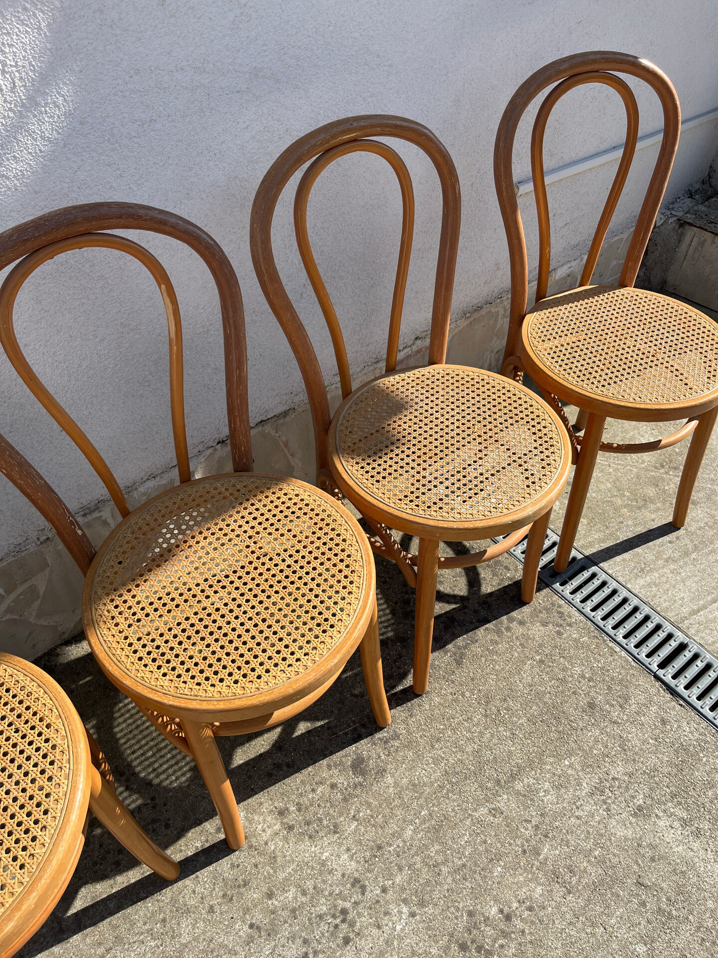 Set of 4 bentwood bistro chairs with caning.