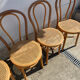 Set of 4 bentwood bistro chairs with caning.