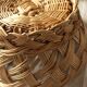 Large vintage twisted wicker basket on a stand