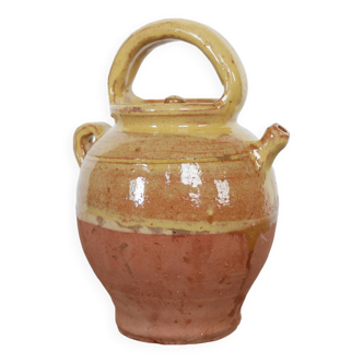 Old gargoulette pot in glazed terracotta