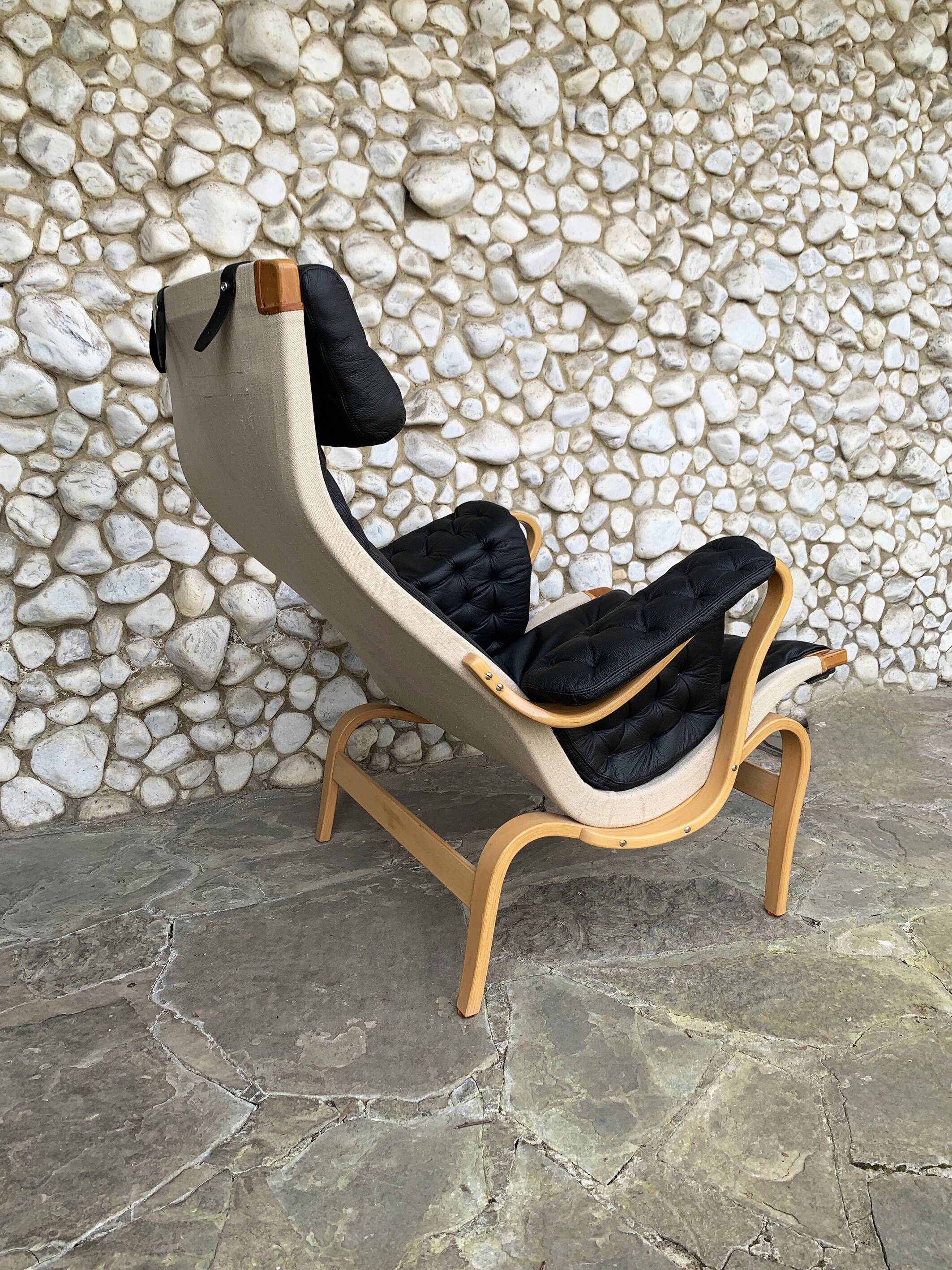 Pernilla armchair new black leather by Bruno Mathsson, Dux, Sweden 1970