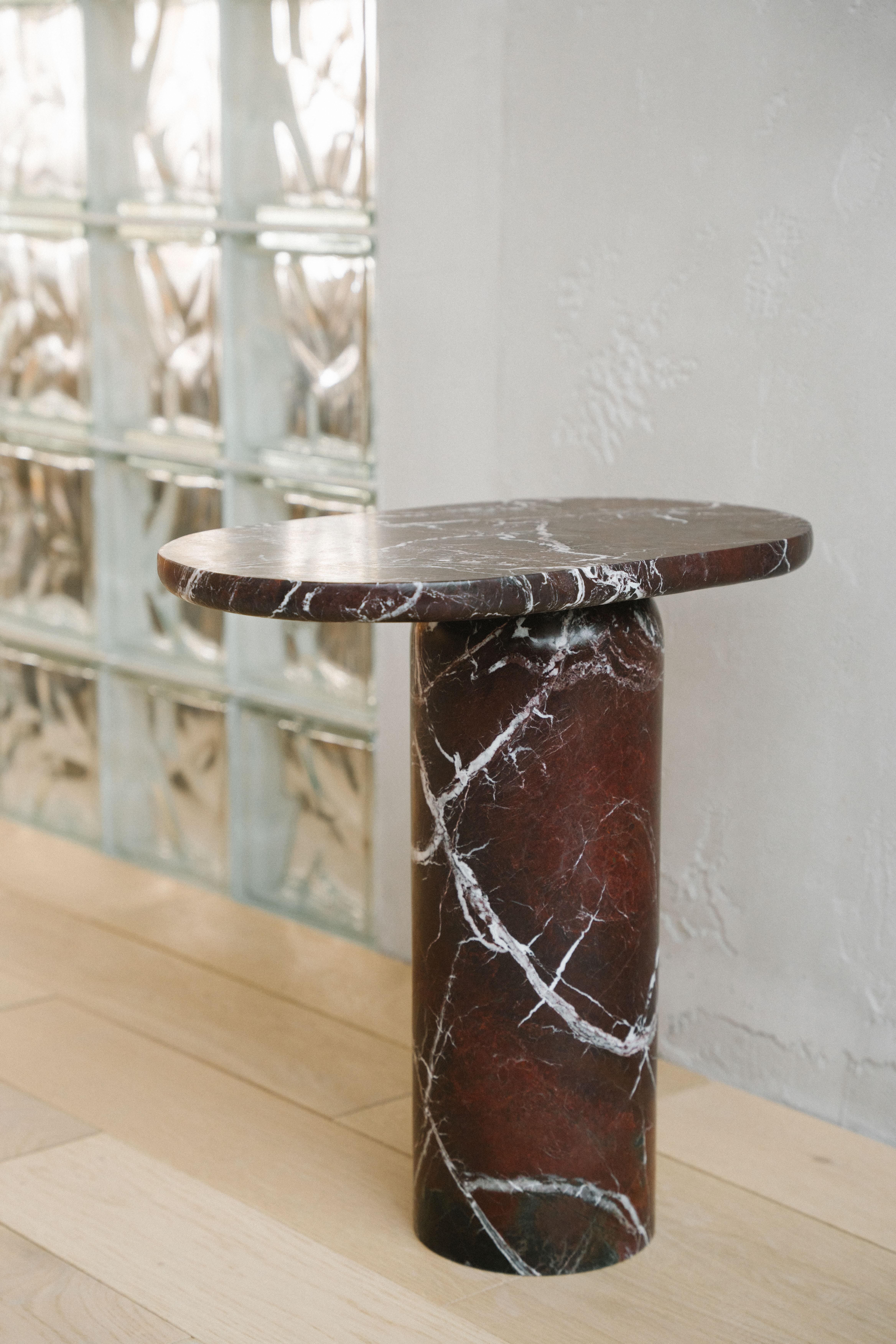 "Bold" side table in Rosso Levanto marble