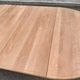 Table à manger ronde extensible décapée en merisier massif brut pied centra