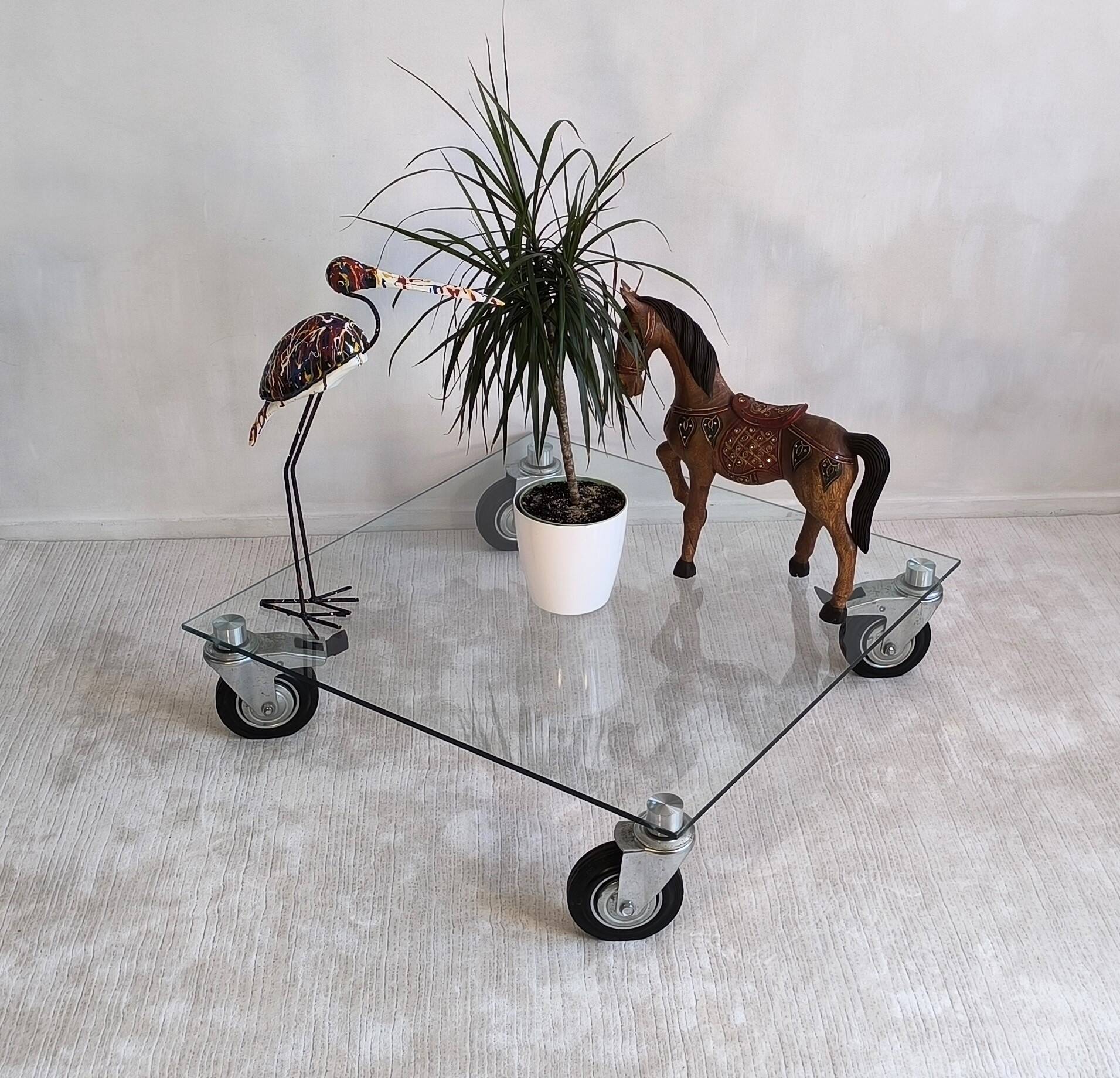 Beautiful designer glass coffee table on wheels