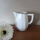 2 white porcelain milk jugs with platinum trim, Flora by Apilco.