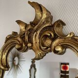 Old baroque style wall mirror with golden moldings