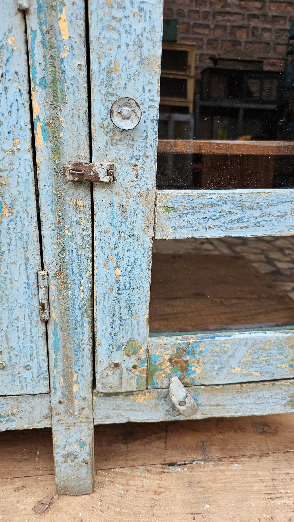 Antique glass-fronted buffet in Burmese teak