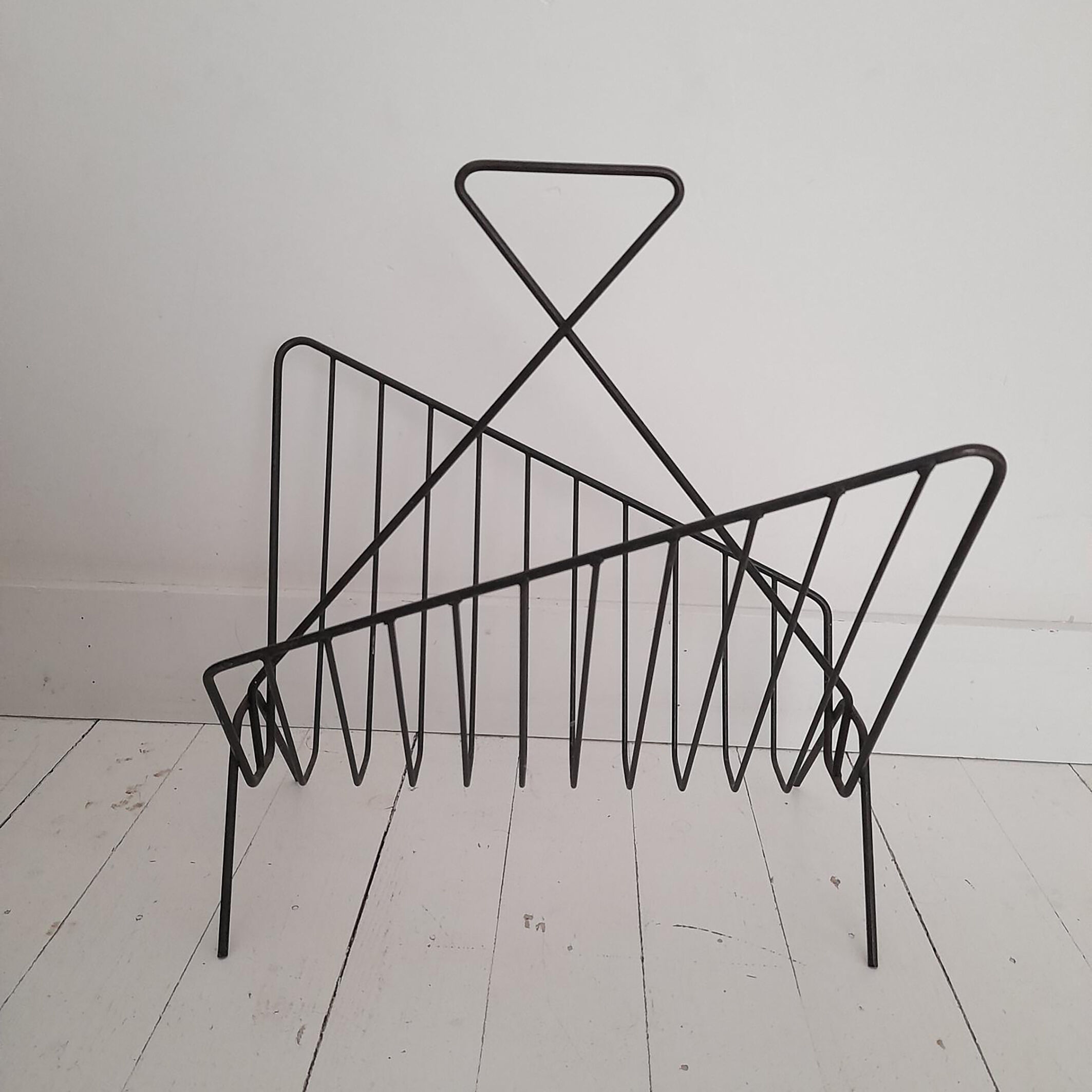 Vintage wrought iron newspaper rack from the 60s