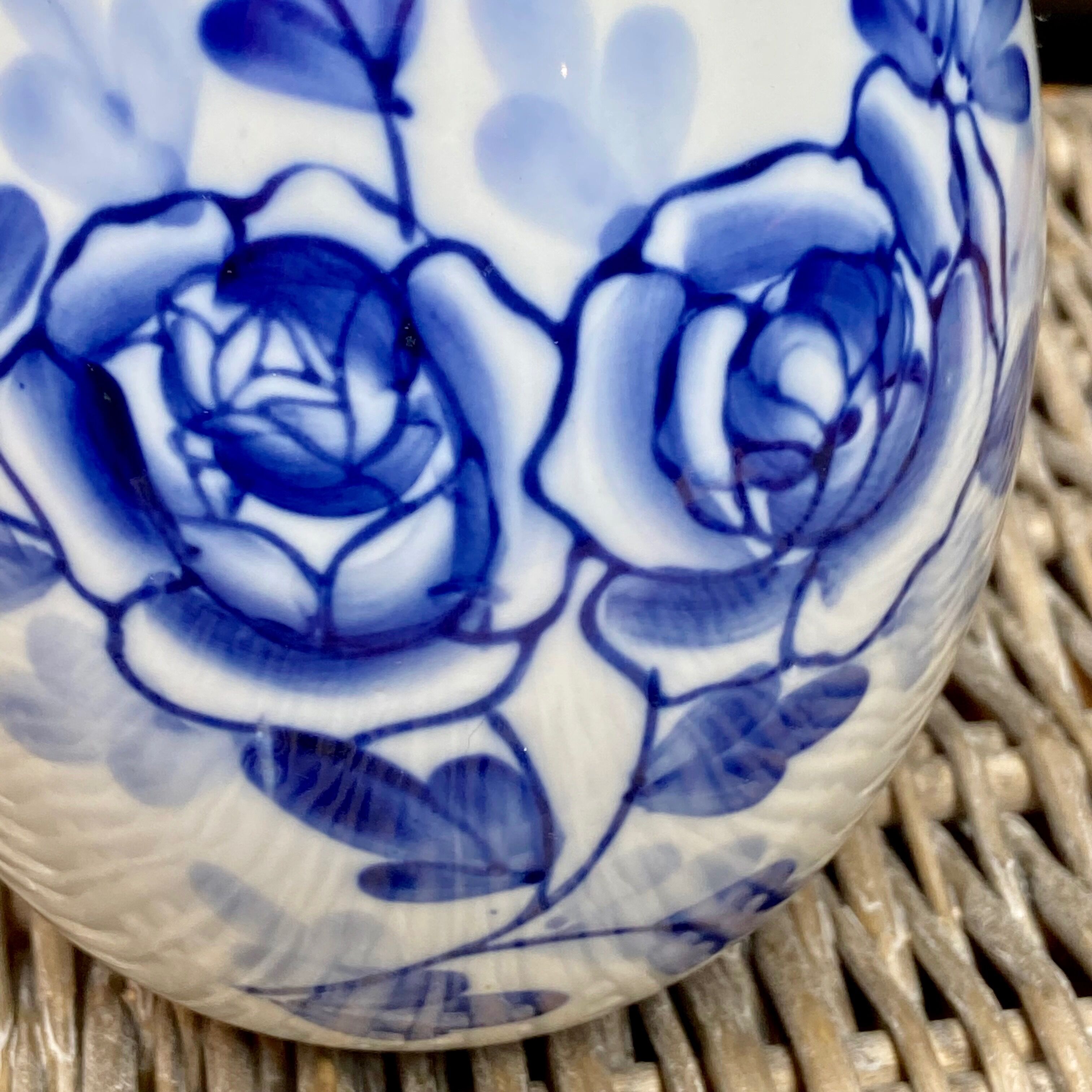 Decorative egg in white porcelain decoration blue flowers
