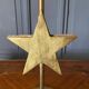 Pair of brass candlesticks decorated with 20th century stars
