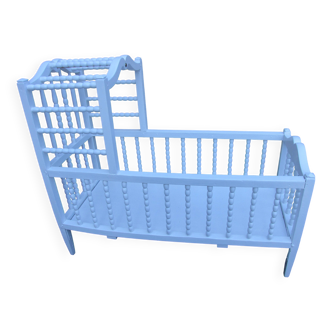 White turned wooden cradle