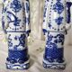 Pair of vintage Chinese blue and white porcelain figurines depicting