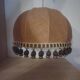 Large hanging pendant light with a burlap and pom-pom style