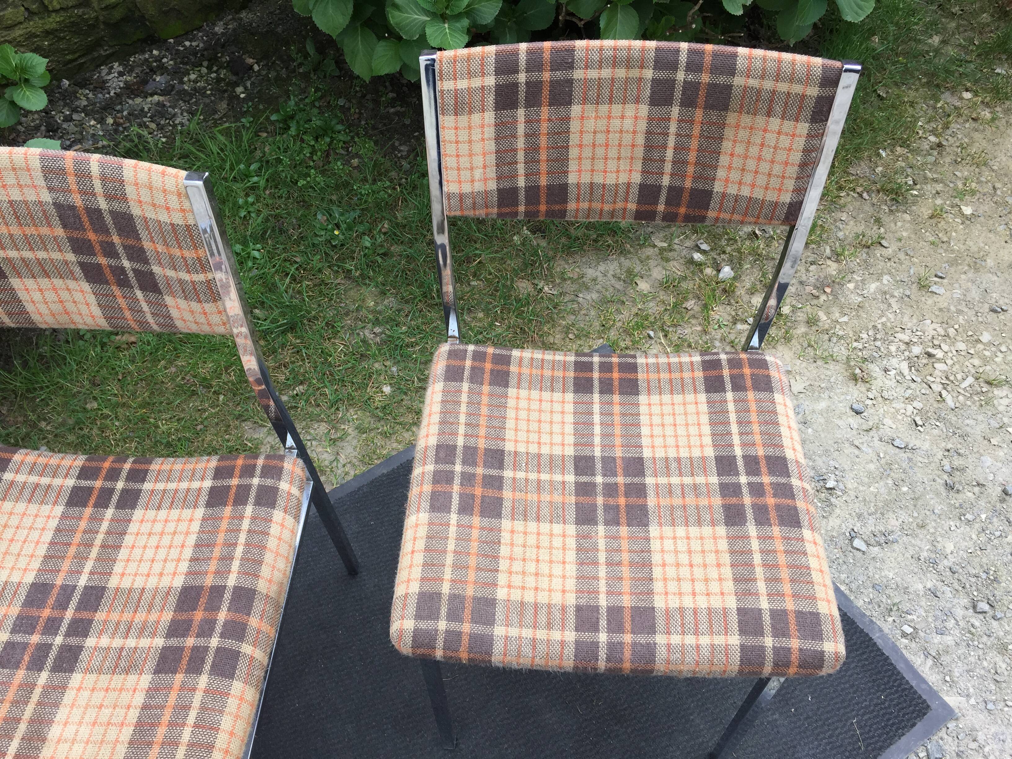 Vintage chairs and stools with chrome-plated square tubular metal base.