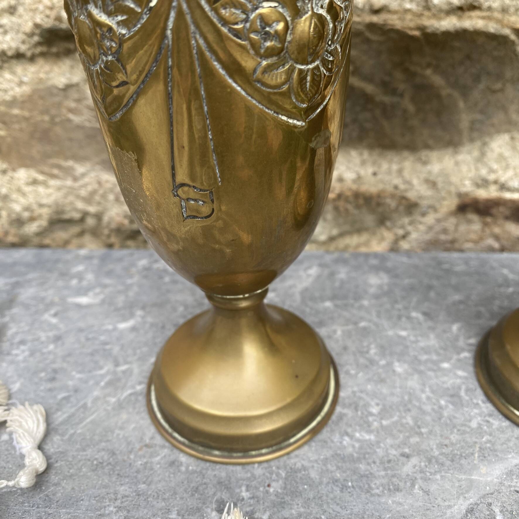 Pair of embossed brass bud vases stamped 17 cm
