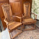 Pair of Renaissance style carved walnut armchairs