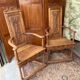 Pair of carved walnut armchairs in Renaissance style