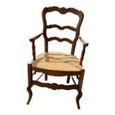 Antique Provençal armchair in wood with a straw seat.