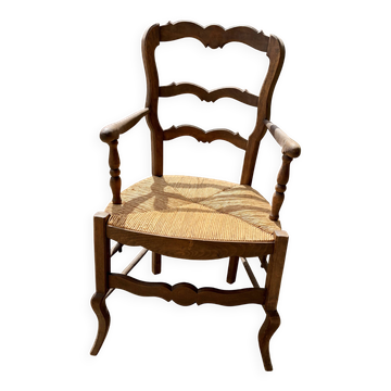 Antique Provençal armchair in wood with a straw seat.