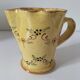 JP Daniel handmade earthenware pitcher – floral decoration on a yellow background