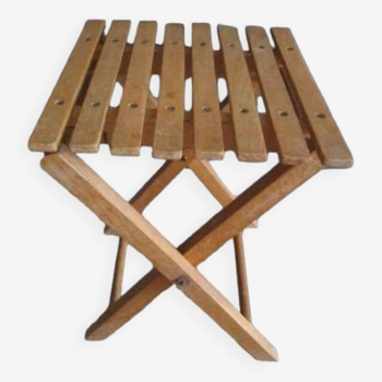 Old folding stool in fisherman's or painter's wood