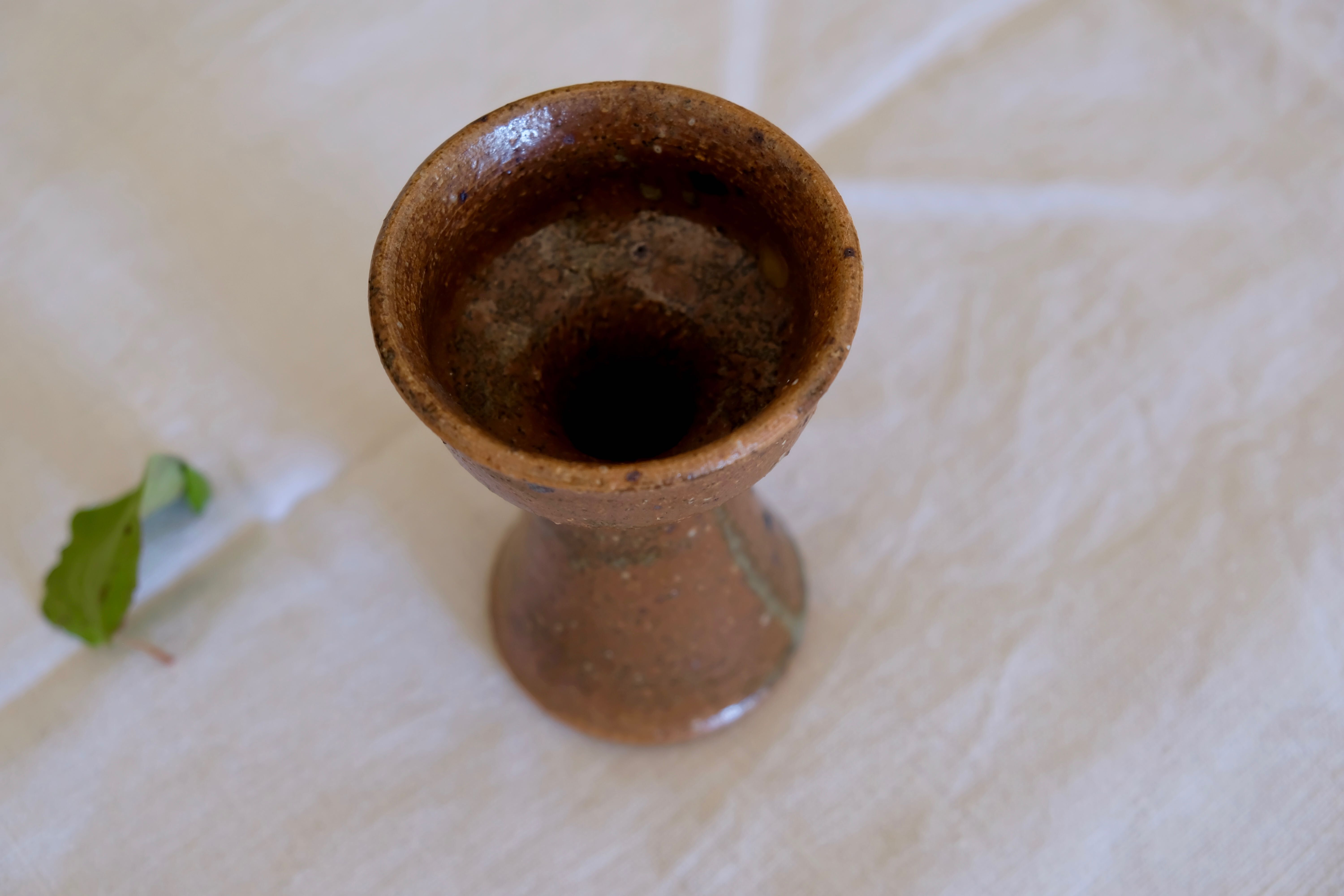 Old sandstone candle holder