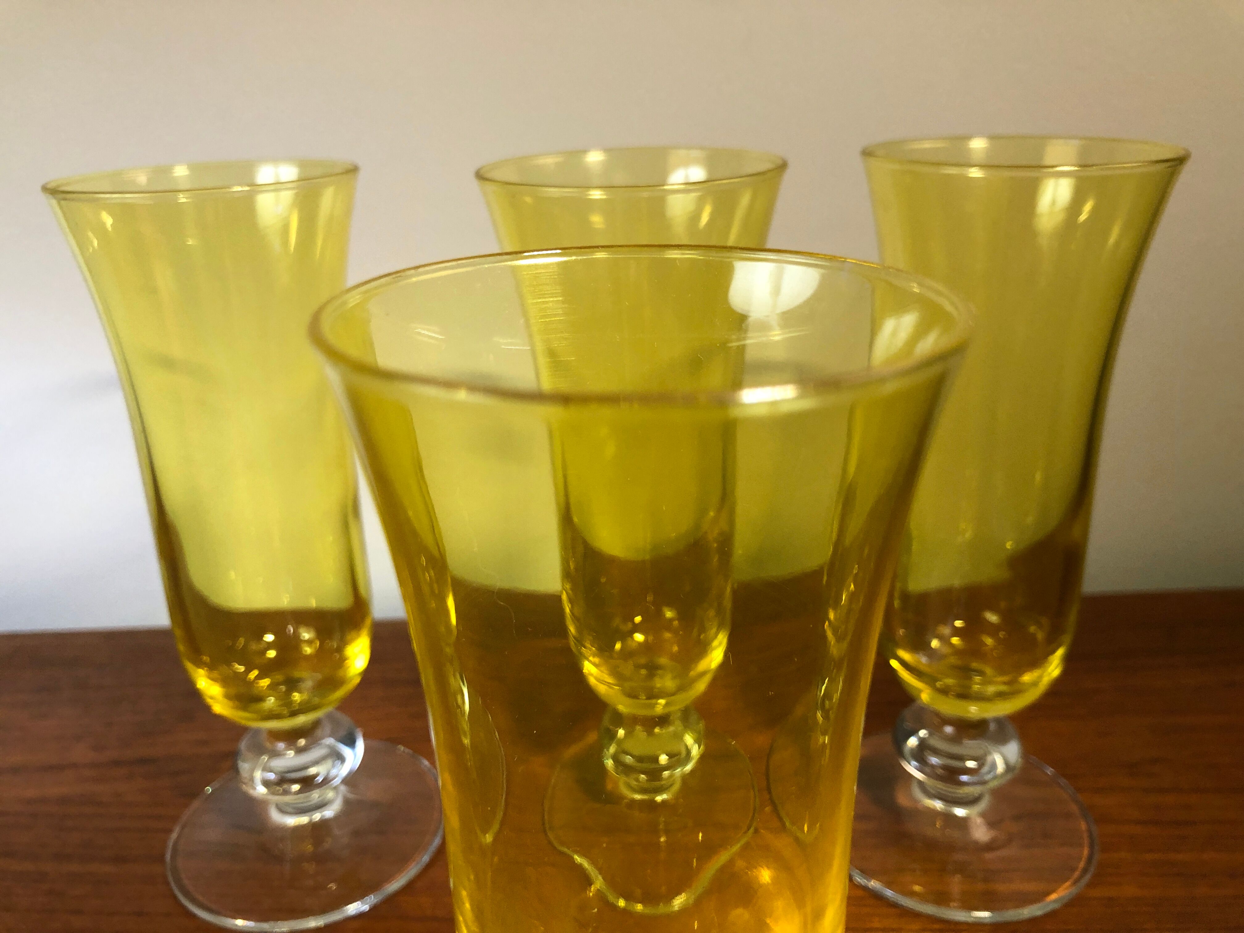 Large transparent yellow champagne flutes