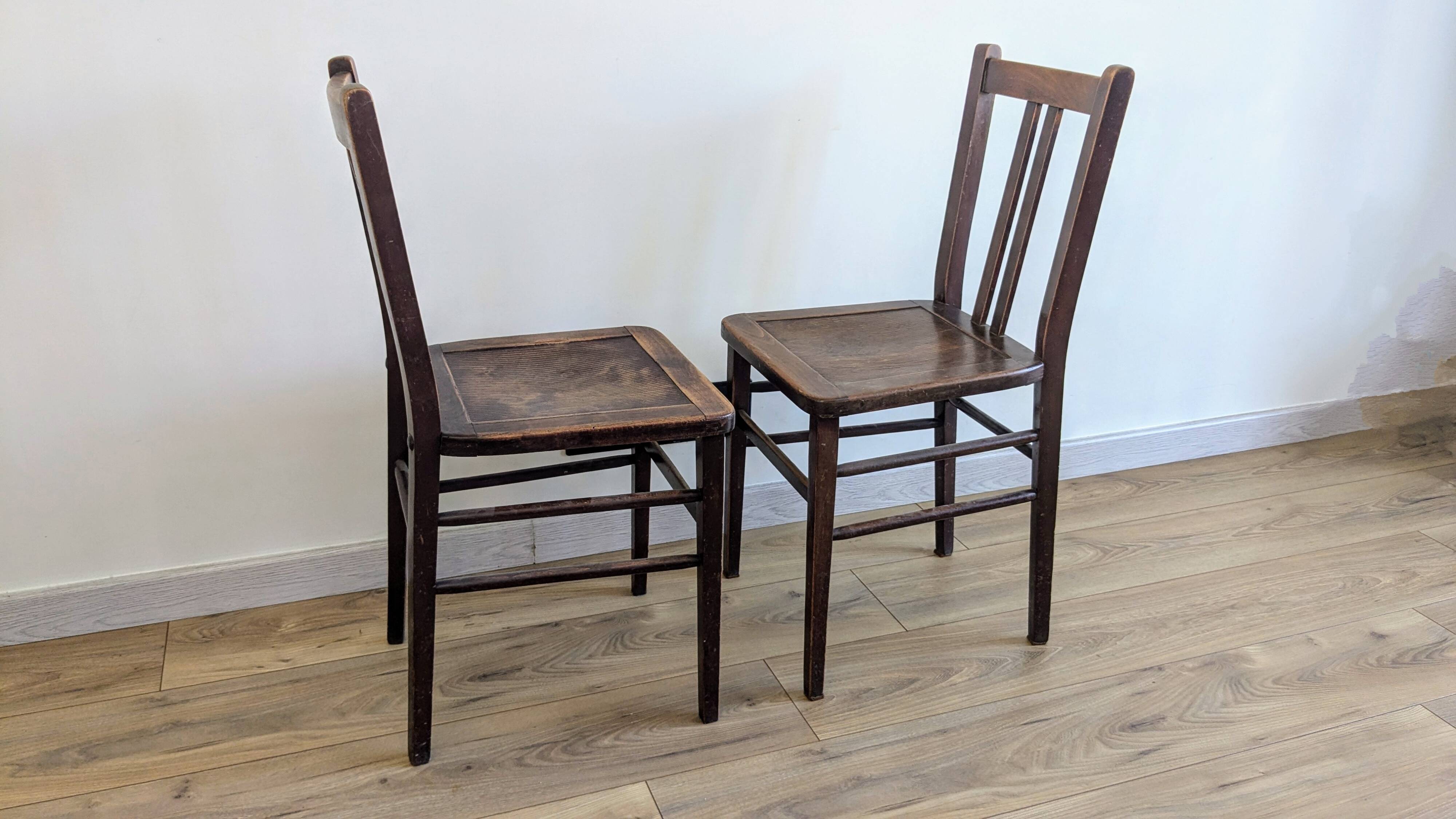 Pair of 1930s bistro chairs with patinated wood.