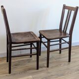 Pair of 1930s bistro chairs with patinated wood.