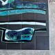 Mid-century Denisco ceramic coffee table — black, blue and white glazed tile top with silver metal base