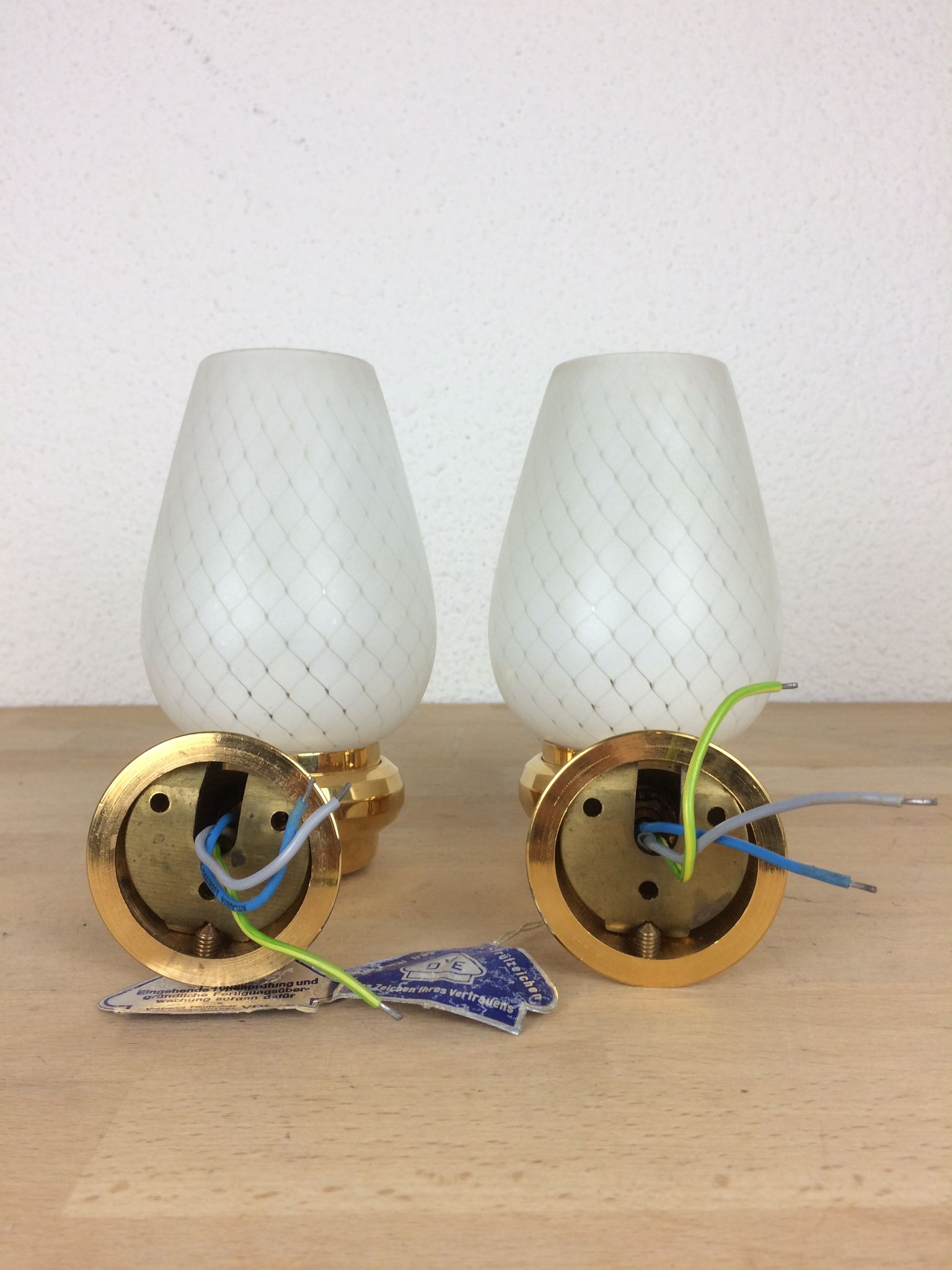 Pair of solid brass and white opaline wall lamps