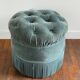 Velvet upholstered pouf