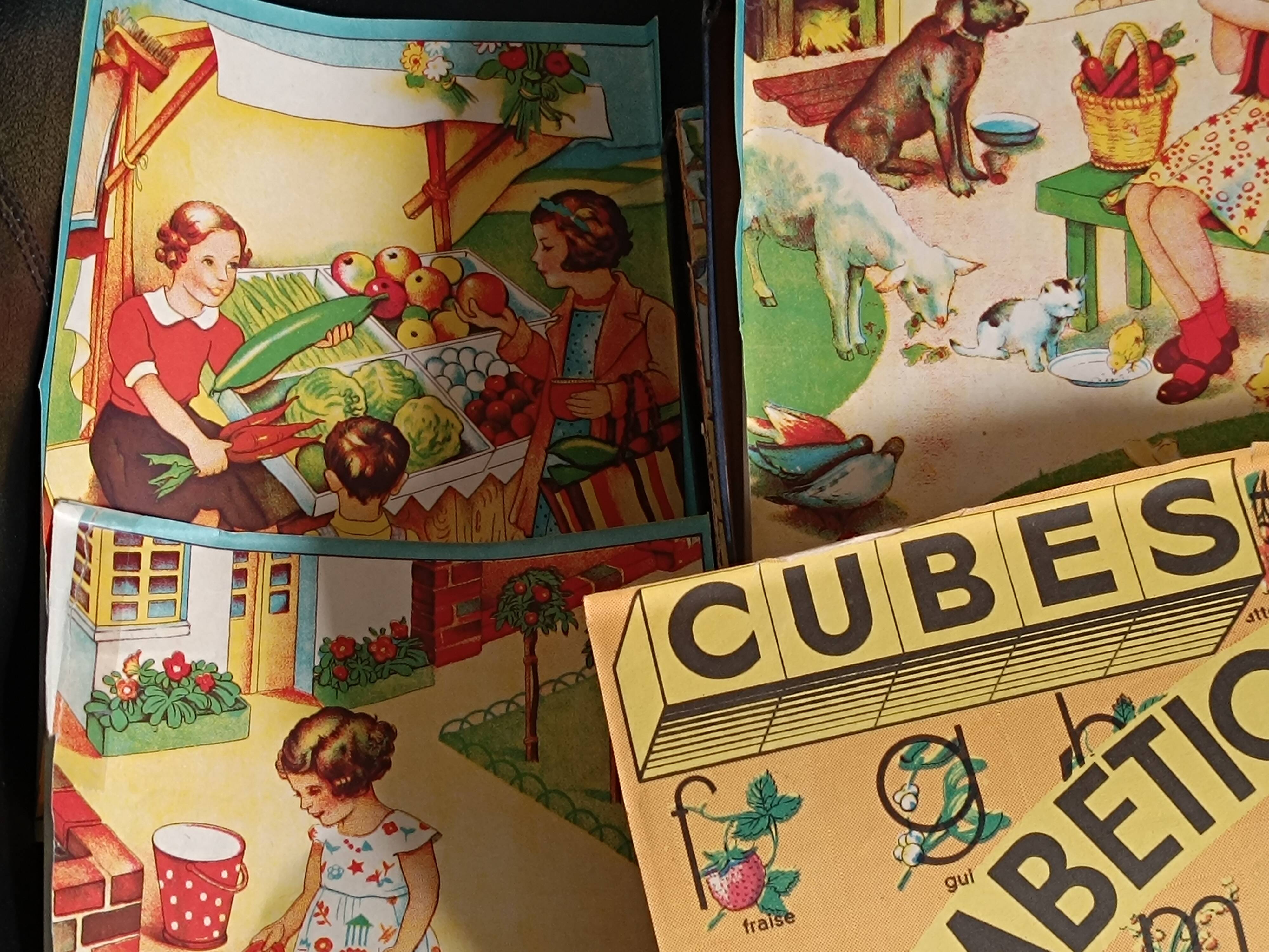 Cardboard box with wooden alphabet cubes from the 60s