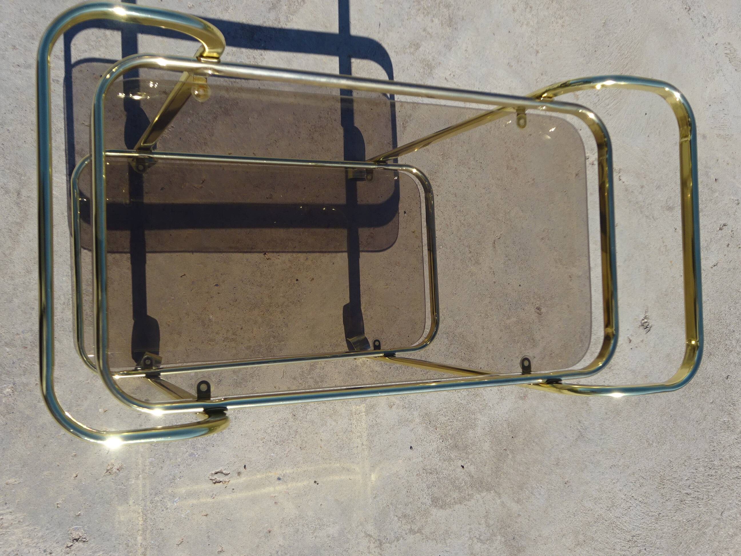 Golden metal and smoked glass dessert table