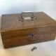 Old wooden box with handle and metal keys