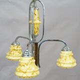 Antique Art Deco chandelier with three glass lampshades.