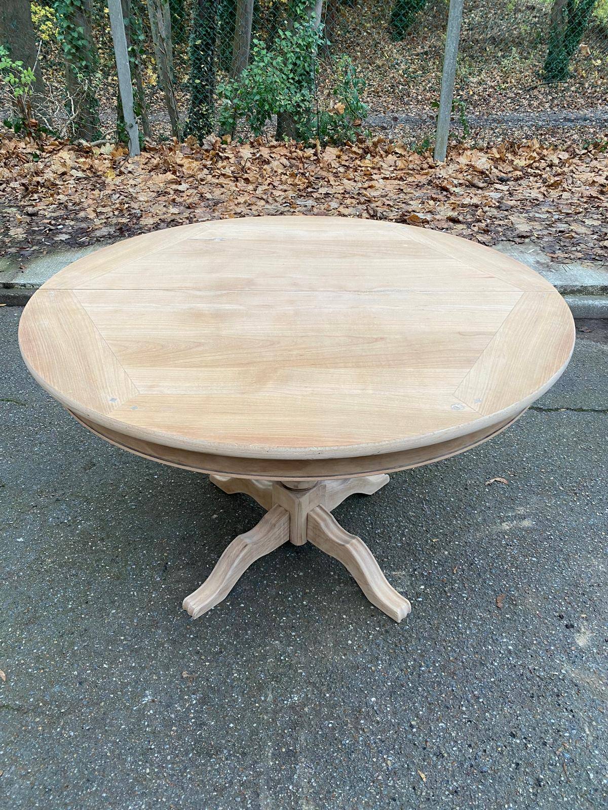 Round extendable dining table with a central pedestal base, renovated in raw wood, 150cm